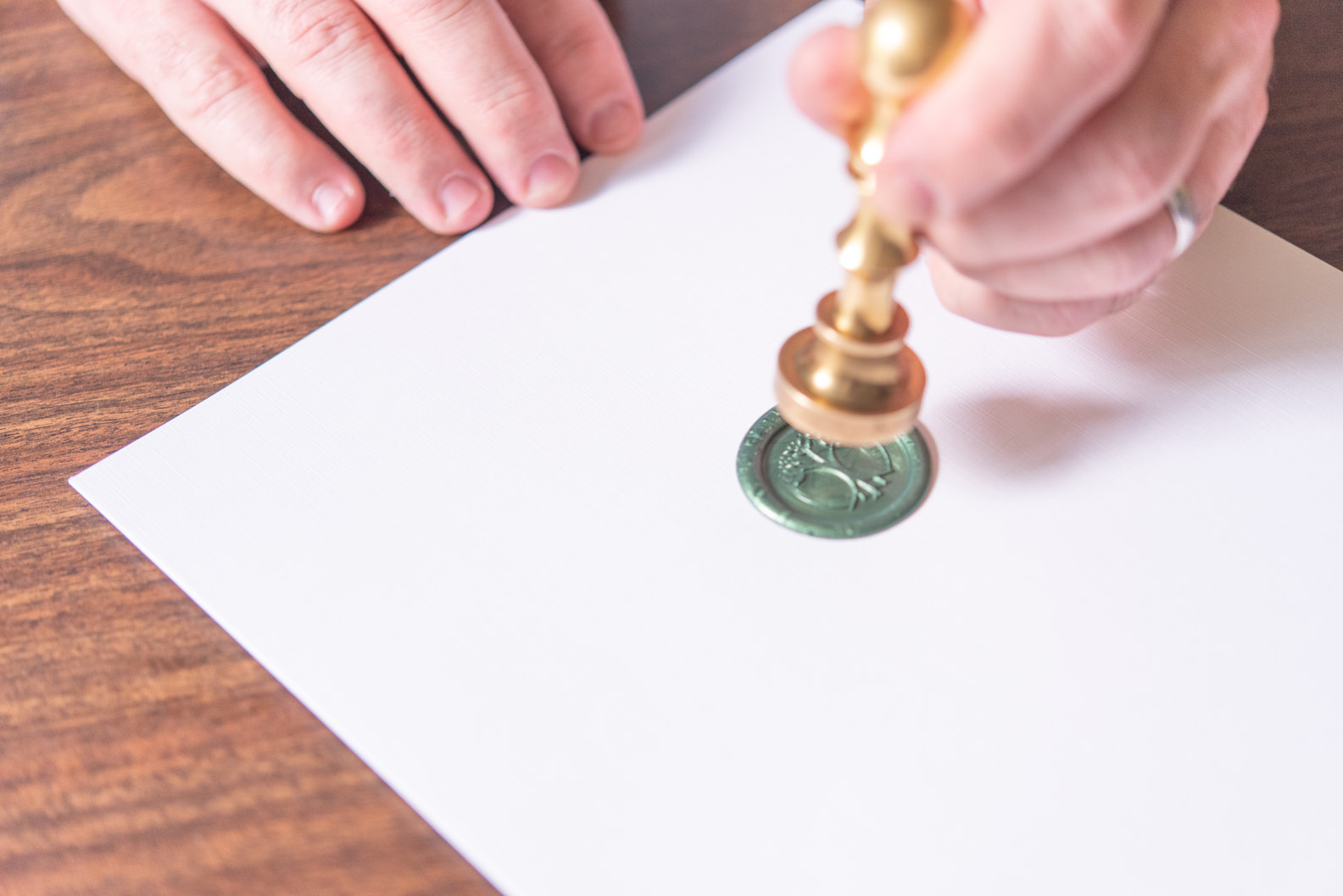 A green wax seal closing the estate plan.